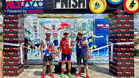 THE octogenarian (right) participated in Ironman Triathlon.