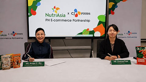 Nutriasia General Manager Ampy Rio and CJ Foods Philippines CEO Joanne Park sign the memorandum of agreement formalizing the digital commerce collaboration between the two culinary giants.