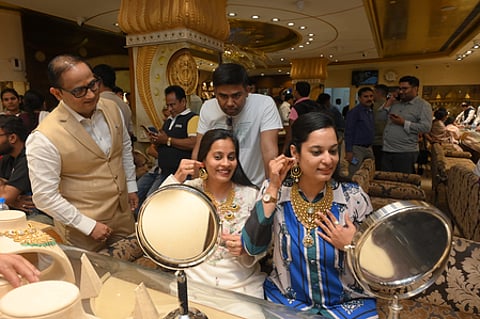 People buying gold jewellery and cars during India’s festive season.