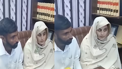 Noor (Sarbjeet Kaur) with Nasir in legal office in Pakistan