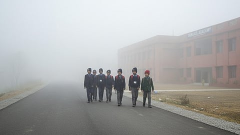 Children going to school in extreme winters