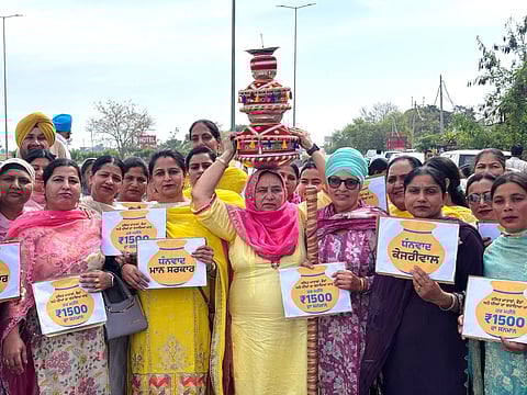 Women celebrate with Jaago procession after aid scheme announcement