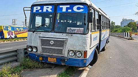 Bus mounts roadside footpath