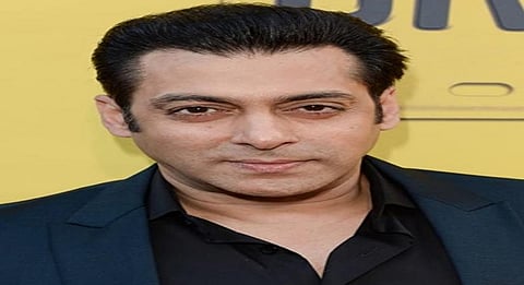 Salman Khan drives an auto-rickshaw on a busy street