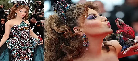 Cannes 2025; Urvashi Rautela stuns in strapless dress, carrying ₹4L parrot—Check outher look