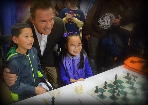 Liberty Bible Academy Student Plays Chess with Arnold Schwarzenegger