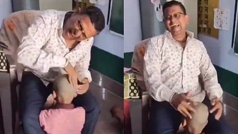 Teacher Dinesh Kumar Mathur beat a student's head as if it were a musical instrument.