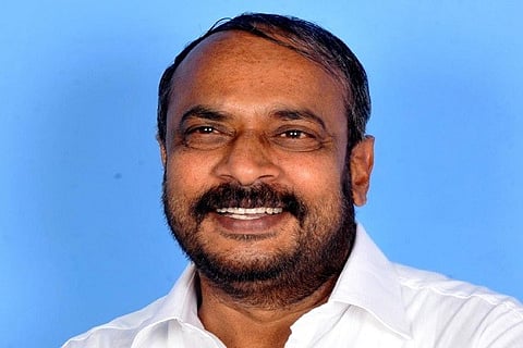 S L DharmeGowda