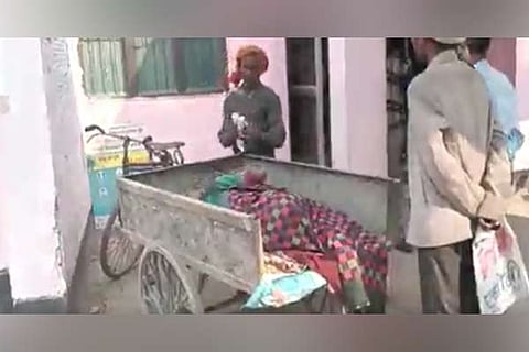 Ailing patient transported on cart due to lack of ambulance