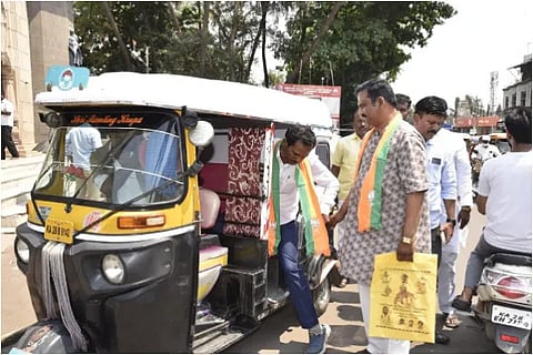 A BJP candidate came in an auto and submitted his nomination