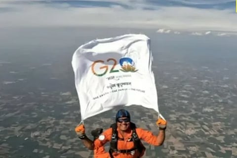 Air Force officer skydives from 10000 feet waves G20 flag mid air watch