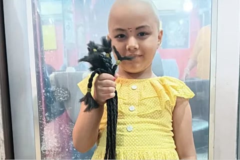 Five year old girl donates hair to cancer stricken woman