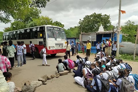 Students protest to stop the bus