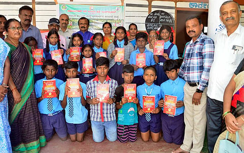 Distribution of English dictionary to the students Mandya