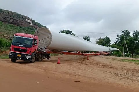 Large truck stuck in the middle of the road