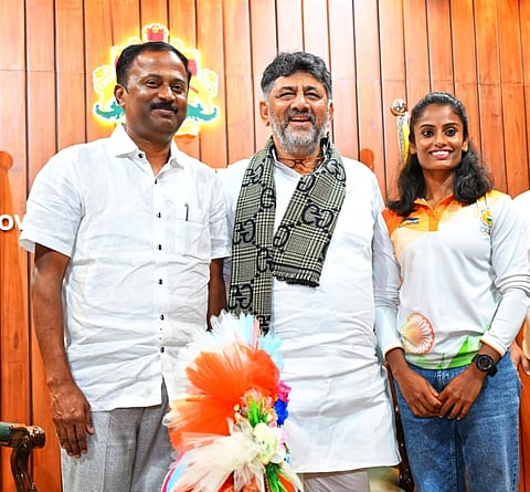 DCM congratulates woman who won gold medal Mandya