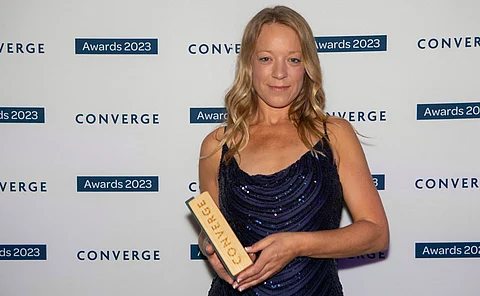 Dr Georgina Robinson, SAMS researcher and CEO of N-ovatio-N, with the Converge Challenge award.