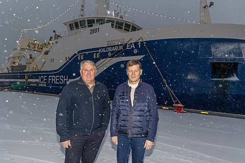 Samherji founders Kristján Vilhelmsson and Þorsteinn Már Baldvinsson with the trawler Kaldbakur EA 1 in the background.
