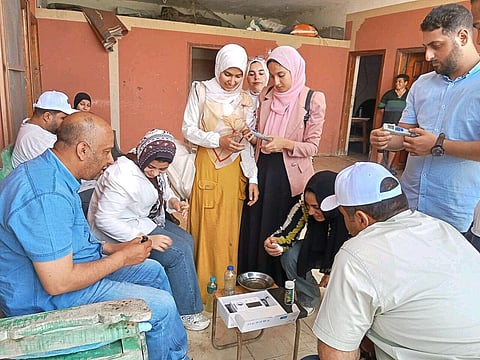 A group of trainees practicing assessment procedure on an Egyptian tilapia farm.