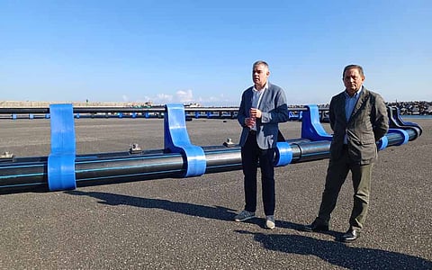 Balfegó deputy director Juan José Navarro (left) pictured with the aquaculture cage structures prior to installation. The 50m-diameter cages are designed to submerge up to 18 meters during storms.