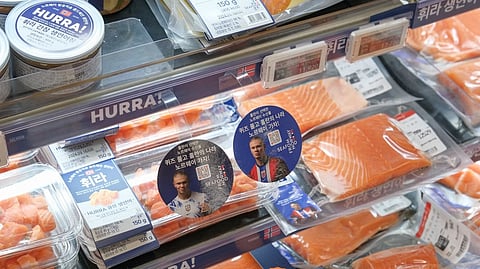 Norwegian salmon with the image of footballer Erling Haaland on display in a Japanese supermarket.