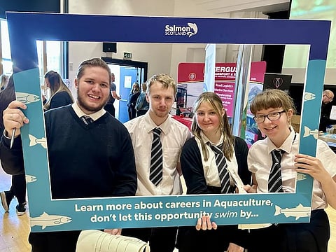 Students holding a selfie frame at Careers Day at Lochaber High School, Scotland.