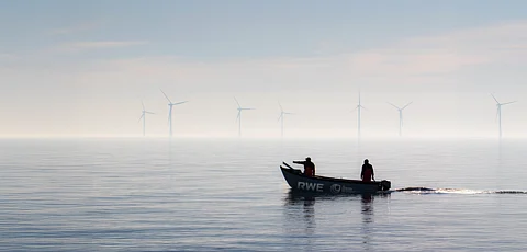 A boat with RWE and The Oyster Restoration Company operators at an offshore wind farm.