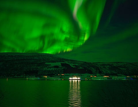 Northern lights (aurora borealis) seen over an aquaculture facility in Norway.