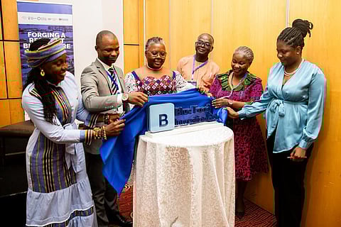 Ghana's Minister of Fisheries and Aquaculture Emelia Arthur (centre) helps to unveil the new logo for the Blue Food Innovation Hub.