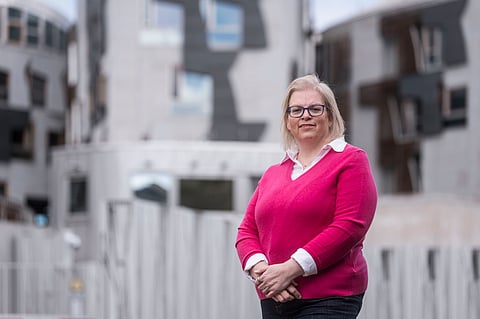 Anne Anderson in front of the Scottish Parliament © Craig Stephen Photography.