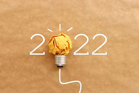 2022 background with light bulb made from paper