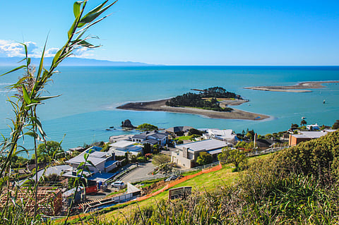 View over Nelson and the coastline from Princes Drive (New Zealand). Photo by: Adobe Stock.
