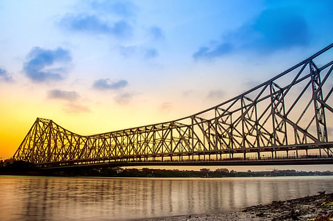 owrah Bridge situated on river Ganges which connects Kolkata city with Howrah in West Bengal, India. Photo by: Adobe Stock.