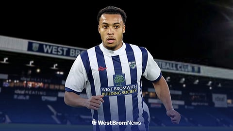 Cameron Archer in a West Brom kit, with The Hawthorns behind him