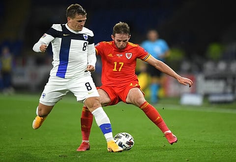 CARDIFF, WALES - NOVEMBER 18: Finland player Robin Lod in action with Rhys Norrington-Davies of Wales (r) during the UEFA Nations League group stage match between Wales and Finland at Cardiff City Stadium on November 18, 2020 in Cardiff, Wales. (Photo by Stu Forster/Getty Images)