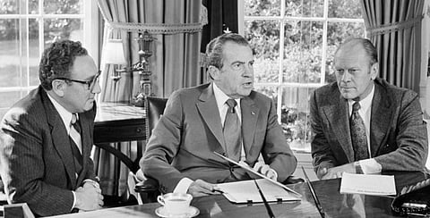 Henry Kissinger with President Nixon and Vice-President Ford at the White House.