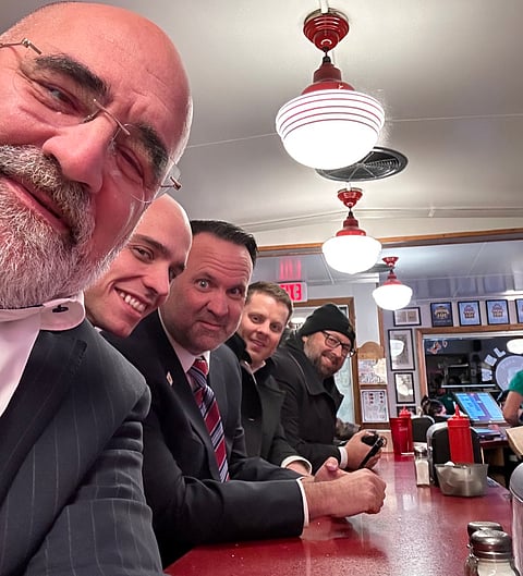 Chris LaCivita front, and the Trump team, enjoy a get-together at the Red Arrow Diner in New Hampshire.
