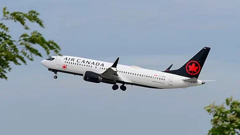 An Air Canada plane is seen during a flight in Montreal in June 2021.
