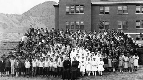 Undated group photo of Kamloops IRS students gathered for what might have been a first communion.