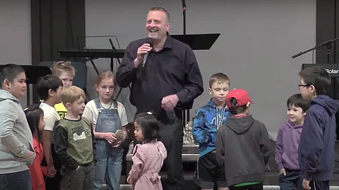 Pastor Mark Lautamus with children from Yorkton Victory Church