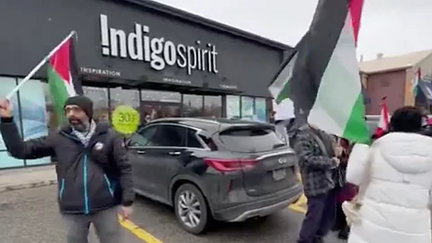 Pro-Palestine demonstrators outside an Indigo Spirit book store in Oakville, Ontario.