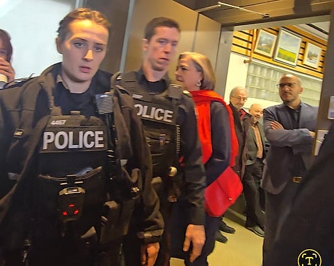 Police arrive to escort Western Standard reporter James Snell from the Mark Carney Liberal leadership event in Edmonton.