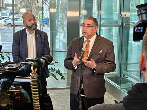 Alberta NDP leader Naheed Nenshi and NDP MLA David Shepherd speak with media at the QEII building in Edmonton on Tuesday
