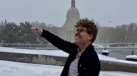Alberta NDP MLA Janice Irwin dances near the Alberta Legislature on March 27, 2025