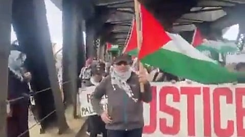 Pro-Hamas demonstrators on Edmonton's Upper Level Bridge. They were quickly removed by members of the Edmonton Police Service