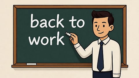 Teacher writing "back to work" on board