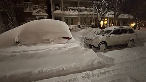 Cars covered in snow in Toronto on Sunday