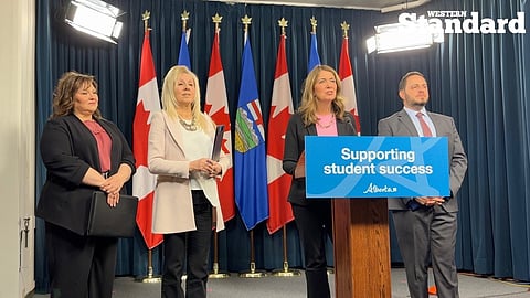 Danielle Smith and Minister Demetrios Nicolaides speeking to reporters.