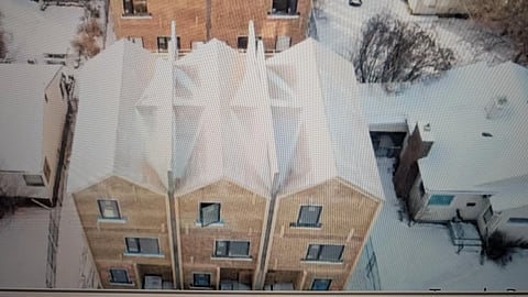 A townhome project between single-family homes