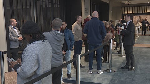 Mayor Farkas talks to the crowd in line to speak at city hall
